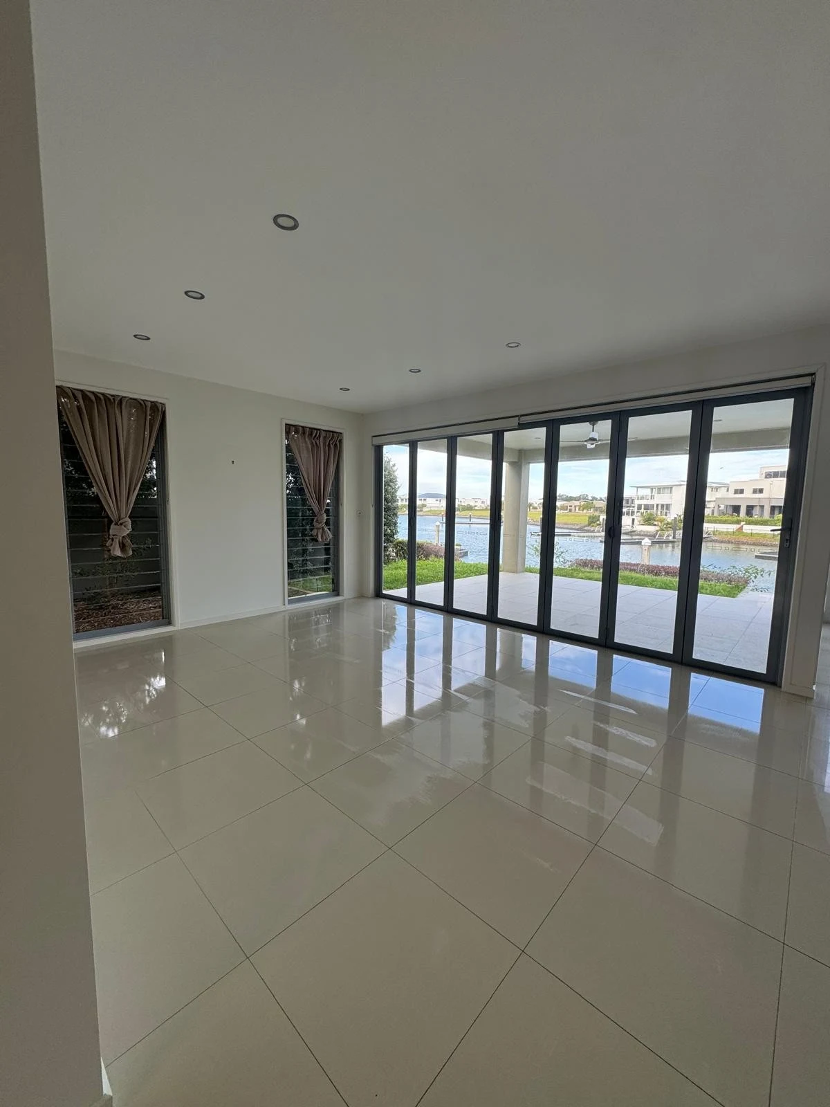Waterfront living area with glass doors