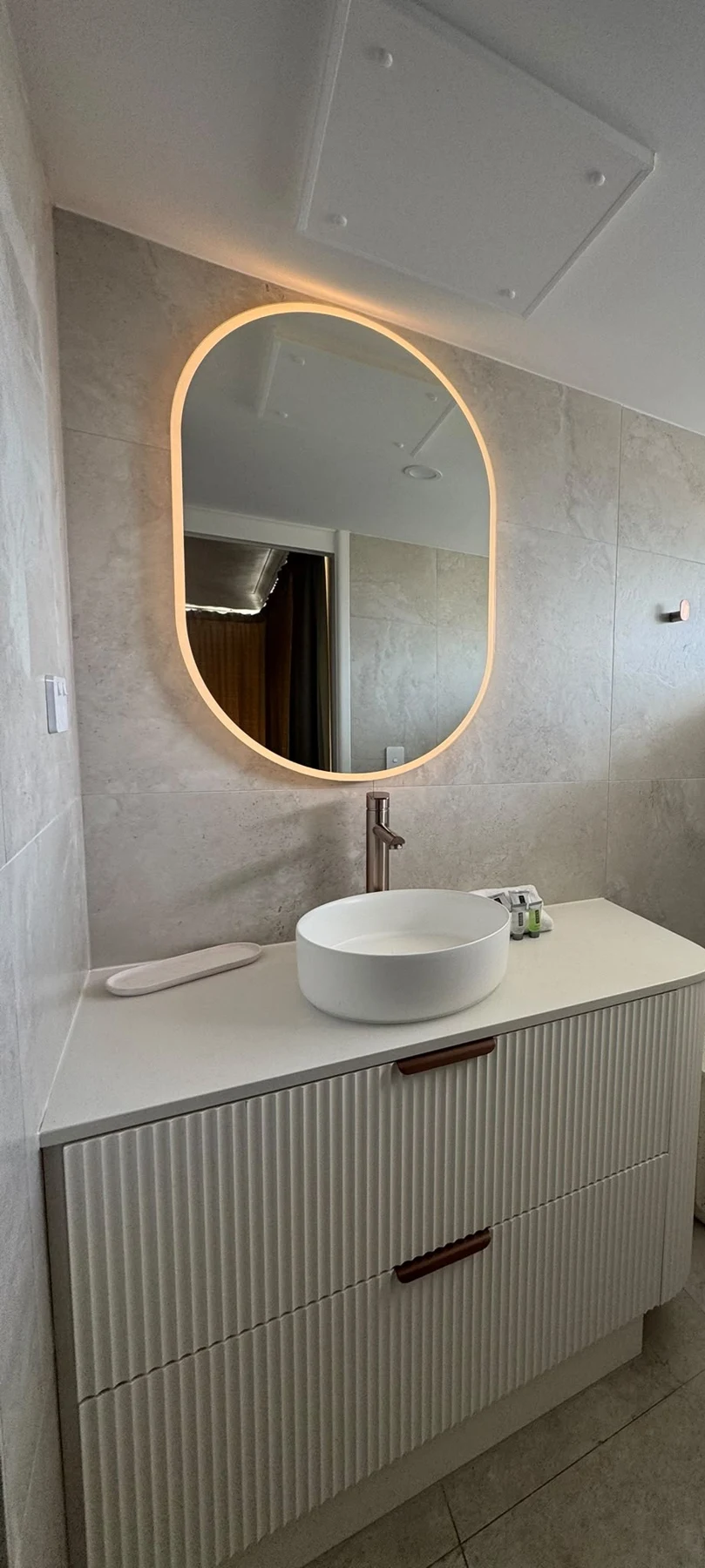 Stone bathroom vanity and mirror